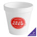 A white Dart foam cup with a red Deja Brew logo.