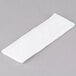 A white tissue paper on a gray surface.