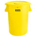 A yellow Lavex commercial trash can with a lid.