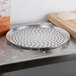 An American Metalcraft 19" perforated heavy weight aluminum pizza pan with holes.