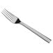 A close-up of a Oneida stainless steel dinner fork with a mirrored finish.
