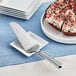 A pie on a plate with an American Metalcraft Belaire pie server.