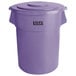 A purple Lavex commercial trash can with lid.