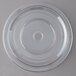 A clear plastic disc with a circular hole.