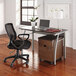 A Linea Italia Trento rectangular desk in mocha and gray with a laptop and black office chair.