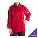 A woman wearing a red Mercer Culinary chef coat.