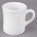 A Tuxton white porcelain mug with a handle.