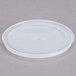 A Cambro translucent plastic lid with a straw slot and a cross on top.