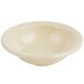 A Carlisle tan melamine fruit bowl with a white rim.