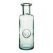 A clear glass carafe with a logo on it.