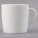 A Tuxton pearl white china mug with a handle.