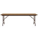 A Correll rectangular folding table with a wooden top and metal legs.