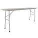 A white rectangular Correll folding table with gray legs.