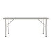 A white rectangular Correll folding table with a gray frame.