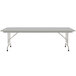 A white rectangular Correll folding table with a gray frame.