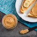 A plate of toast with Producers Peanut Company peanut butter and banana slices.