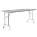 A white rectangular table with a gray frame and metal legs.