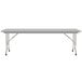 A gray rectangular Correll folding table with a gray metal base.