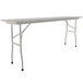 A white rectangular Correll folding table with gray legs.