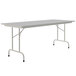 A rectangular white Correll folding table with a gray frame.