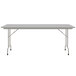 A gray rectangular Correll folding table with a gray metal frame.