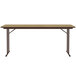 A brown rectangular Correll seminar table with black legs.
