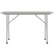 A white rectangular Correll folding table with a gray frame.