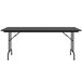 A black Correll rectangular folding table with black legs.