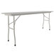 A gray rectangular folding table with gray legs.