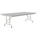 A white rectangular Correll folding table with a metal frame.