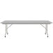 A gray rectangular folding table with a gray frame.