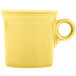 A yellow Fiesta china mug with a handle.