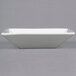 A white square bowl on a gray background.