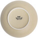 A close-up of a Tuxton bowl with a matte beige embossed design.