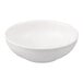 A Tuxton TuxTrendz Zion matte white china bowl with a curved edge.