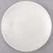 A Tuxton TuxTrendz white china plate with a white rim.