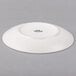 A Tuxton TuxTrendz white china plate with a coupe shape.