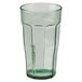 A Cambro Spanish green plastic tumbler with a straw.