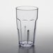 A clear plastic tumbler with a black rim.