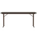 A brown rectangular Correll seminar table with off-set legs.
