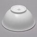 A white Schonwald porcelain bowl on a gray background.