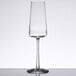A close up of a Stolzle flute wine glass on a table.