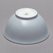 A white Schonwald porcelain bowl on a gray surface.