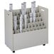 A white metal rack with several rolls of paper.