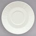 A Schonwald white porcelain saucer with a patterned white rim.