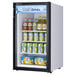 A Turbo Air black countertop display refrigerator with a glass swing door full of beverages.