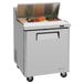 A Turbo Air stainless steel refrigerated sandwich prep table on wheels.