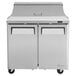 A stainless steel Turbo Air refrigerated sandwich prep table with two doors.