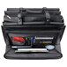 A black Solo Harrison vinyl briefcase with a pocket full of items.