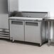 A Turbo Air stainless steel refrigerated sandwich prep table with two doors.